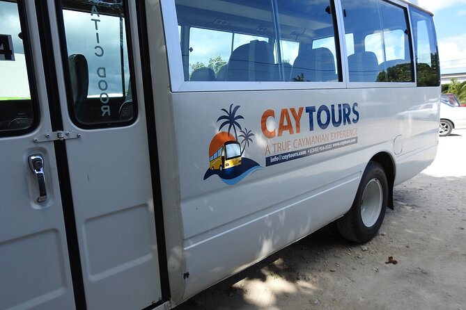 Airport Transfer to West Bay Accommodations (GCM)-Round Trip - Drivers can add more than a ride