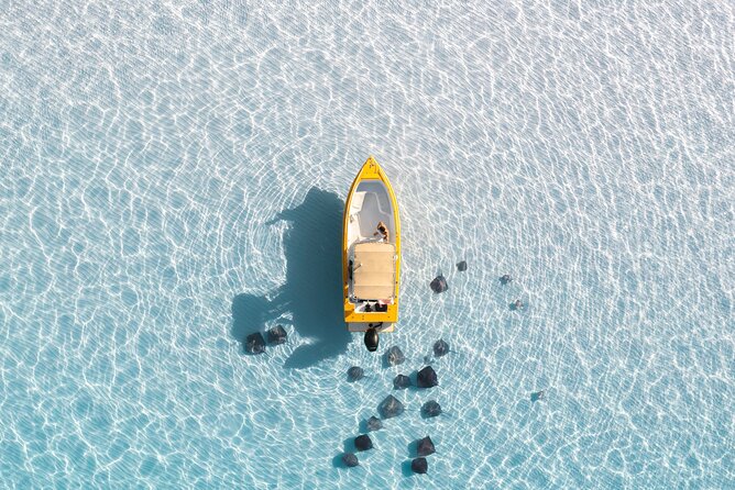 A boat anchored over the Stingray City sandbar in the North Sound, Grand Cayman